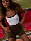chocolate brown cycling shorts with high rise from varley model shot