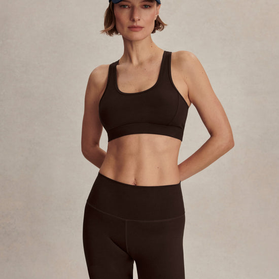 chocolate brown cycling shorts with high rise from varley model shot