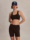 chocolate brown cycling shorts with high rise from varley model shot