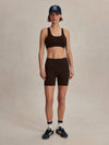 chocolate brown cycling shorts with high rise from varley model shot