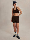 chocolate brown cycling shorts with high rise from varley model shot