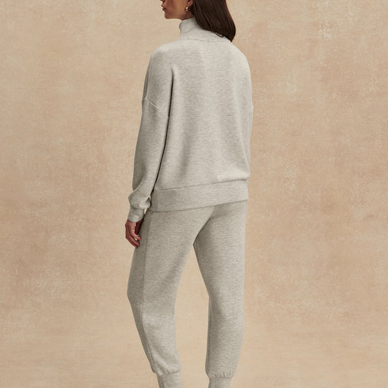 light grey marl half zip sweatshirt from varley rear view