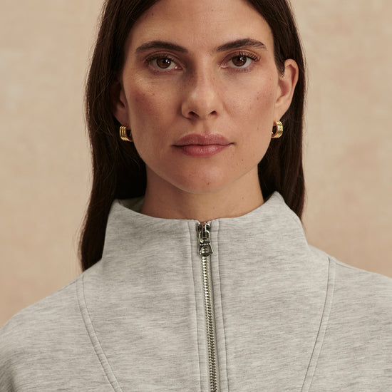 light grey marl half zip sweatshirt from varley close up