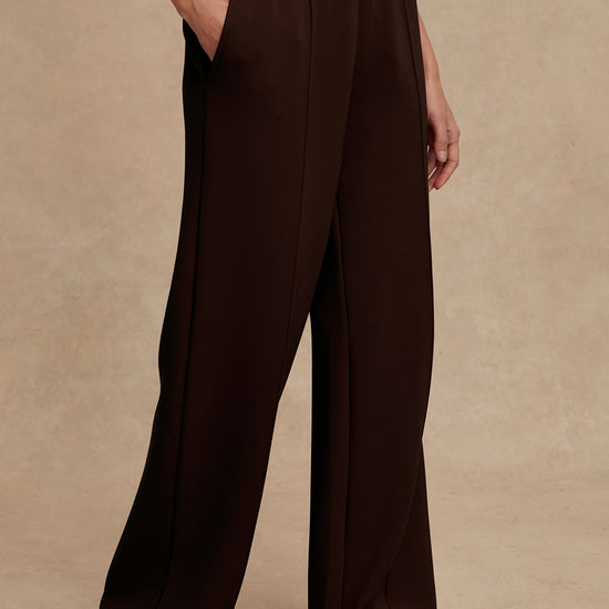 wide leg sweat pants with elasticated waist and piping in the middle down the leg from varley 