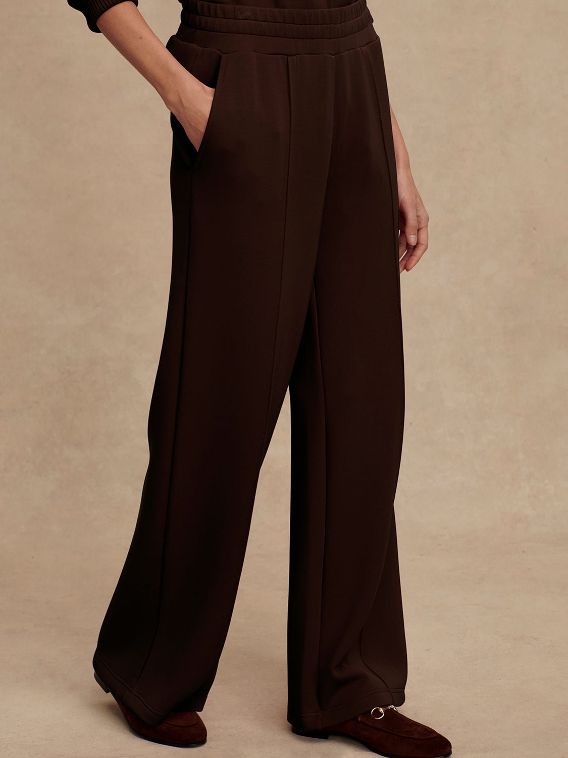 wide leg sweat pants with elasticated waist and piping in the middle down the leg from varley 