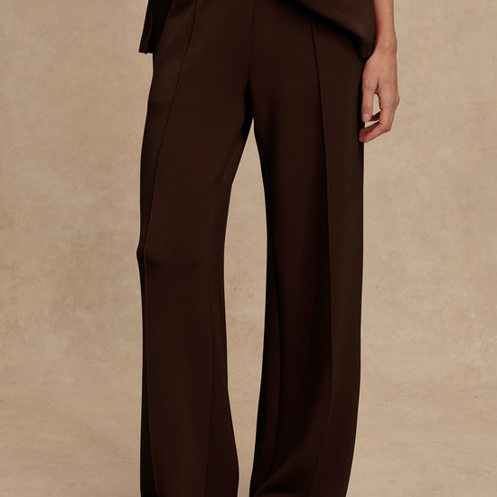 wide leg sweat pants with elasticated waist and piping in the middle down the leg from varley