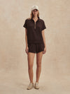 short sleeve chocolate brown sweatshirt with half zip from varley model shot