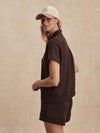 short sleeve chocolate brown sweatshirt with half zip from varley side view