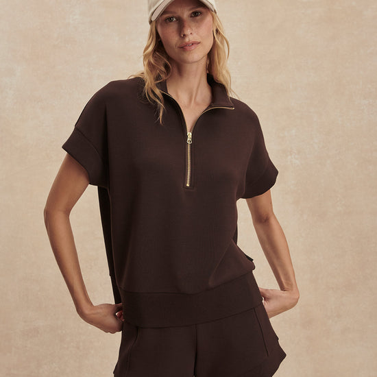 short sleeve chocolate brown sweatshirt with half zip from varley model shot