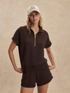 short sleeve chocolate brown sweatshirt with half zip from varley model shot