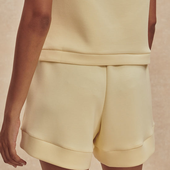pale yellow soft shorts with elasticated waistband from varley rear view