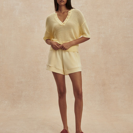 v neck crochet knit short sleeve pale yellow jumper from varley model shot