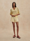 v neck crochet knit short sleeve pale yellow jumper from varley model shot
