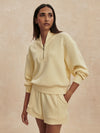 pale yellow jumper with half zip from varley model shot