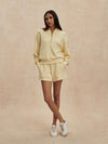 pale yellow jumper with half zip from varley model shot