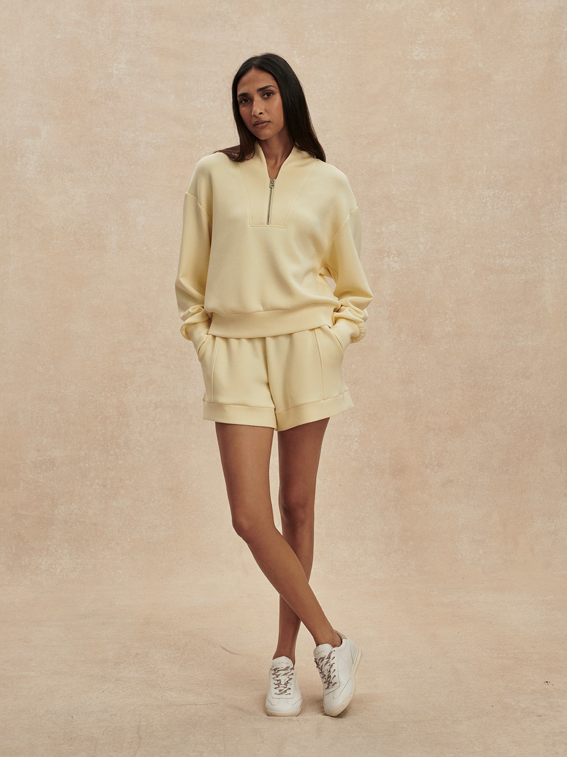pale yellow jumper with half zip from varley model shot