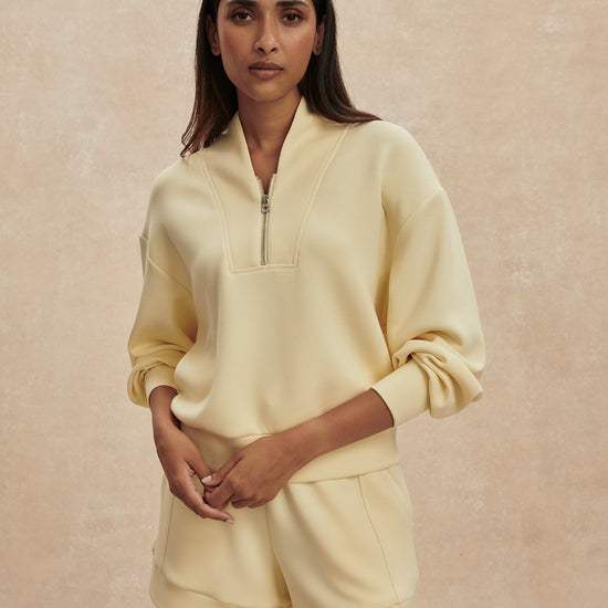 pale yellow jumper with half zip from varley