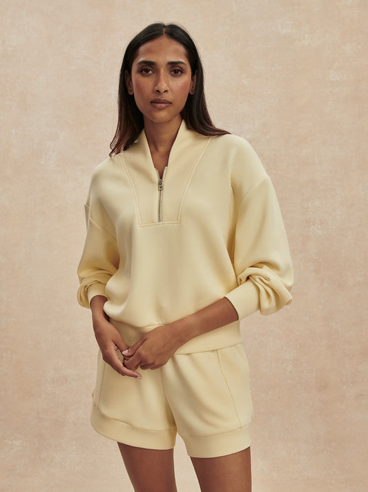 pale yellow jumper with half zip from varley