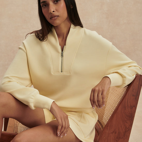 pale yellow jumper with half zip from varley model shot