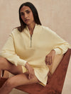 pale yellow jumper with half zip from varley model shot