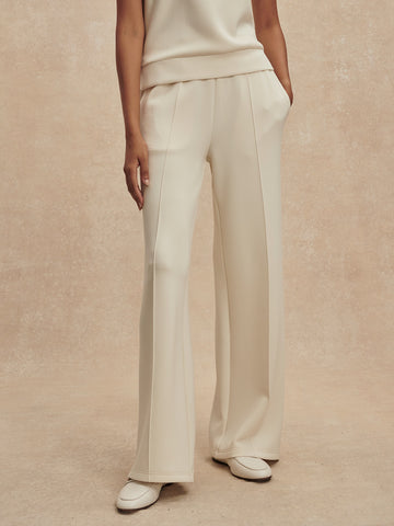 wide leg ivory sweat pants with piping down the centre from varley