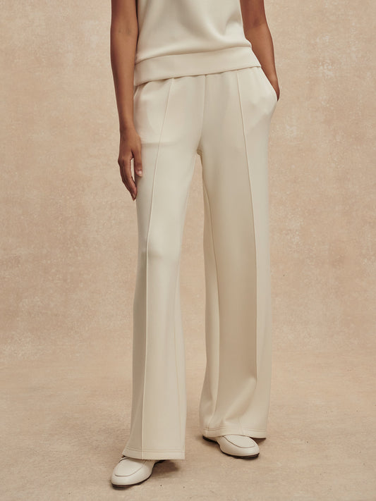 wide leg ivory sweat pants with piping down the centre from varley