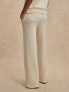 wide leg ivory sweat pants with piping down the centre from varley rear view