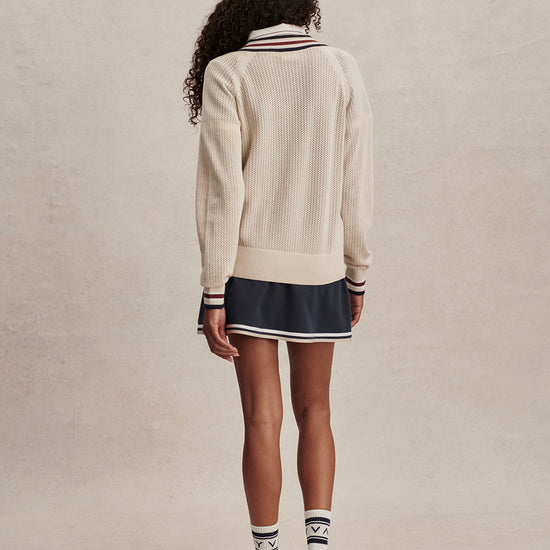 v neck cricket style knitted jumper in beige from varley rear view