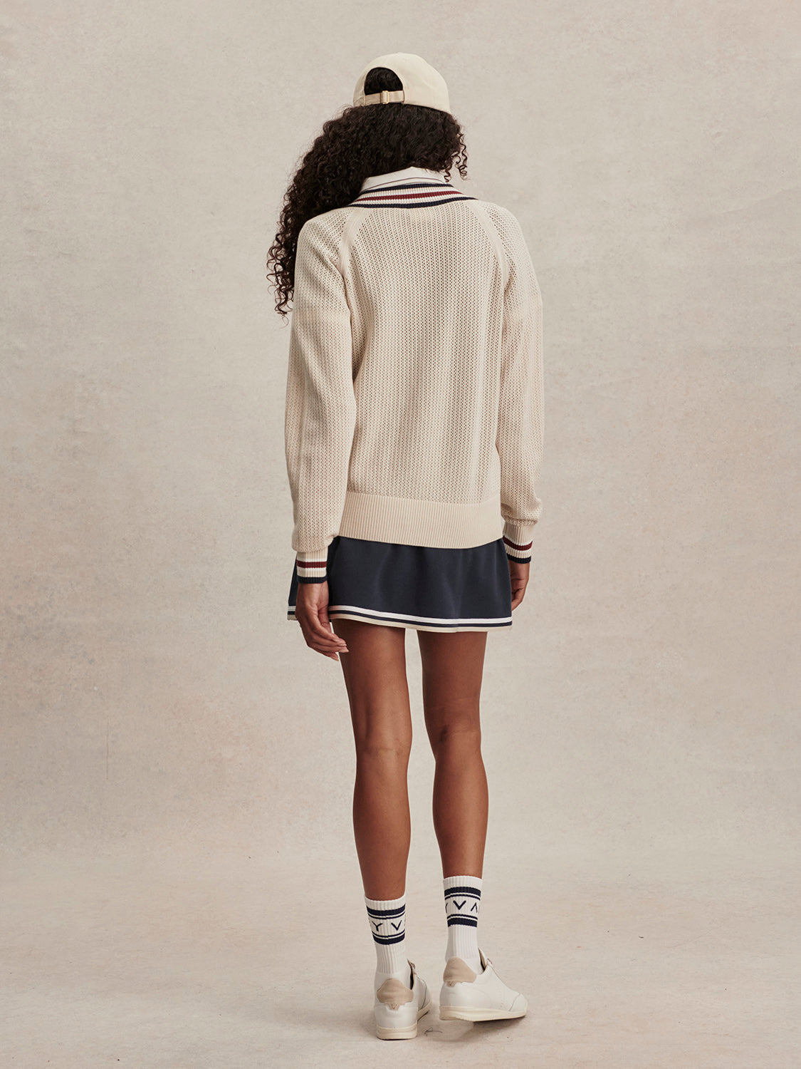 v neck cricket style knitted jumper in beige from varley rear view