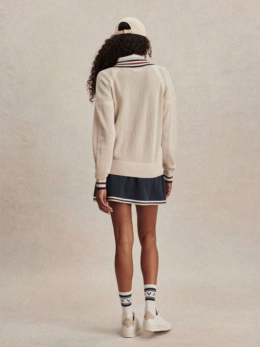 v neck cricket style knitted jumper in beige from varley rear view