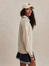 v neck cricket style knitted jumper in beige from varley side view