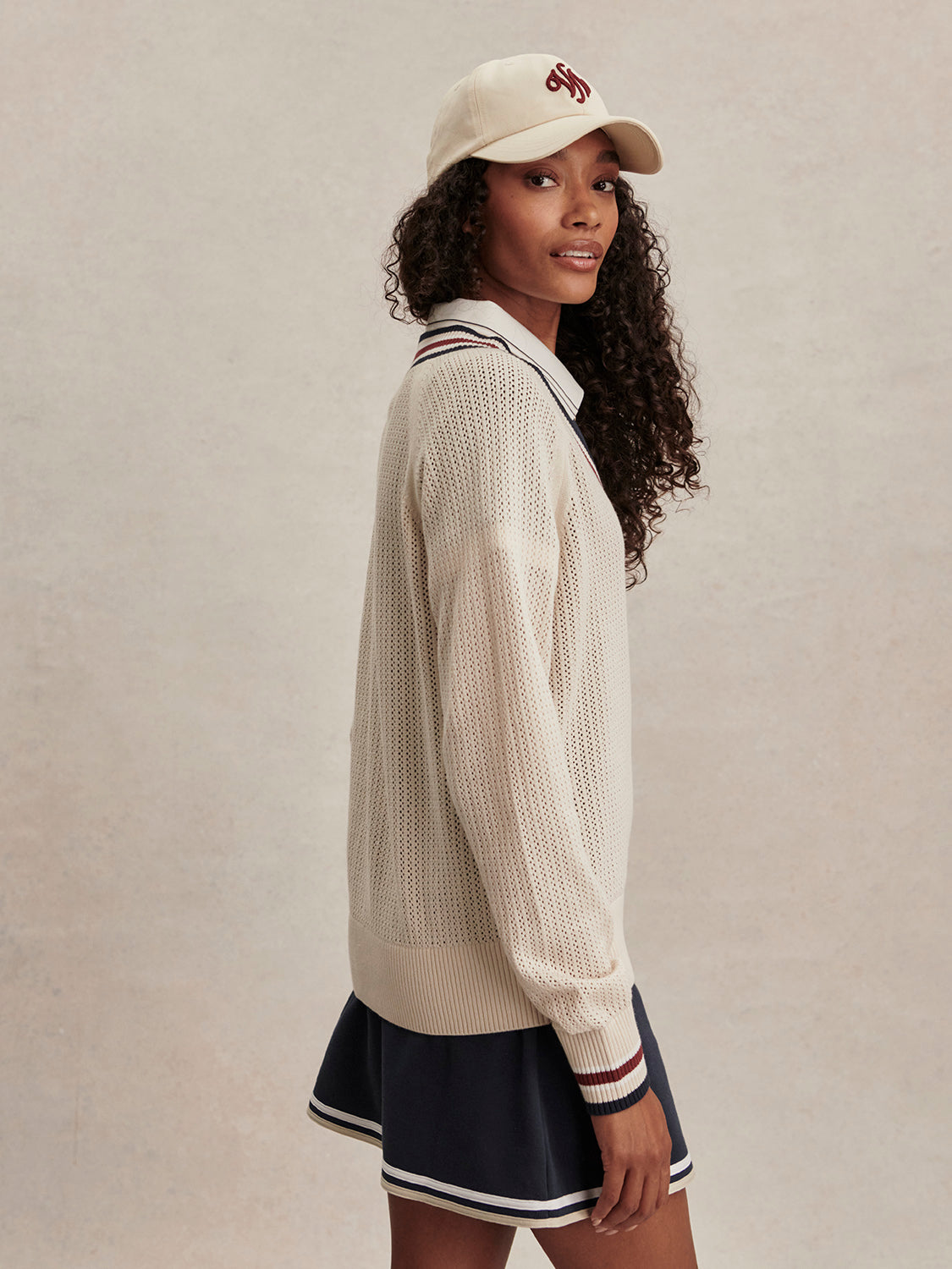 v neck cricket style knitted jumper in beige from varley side view