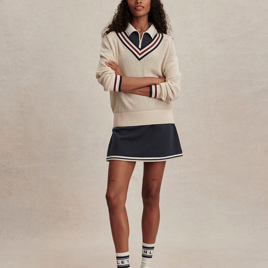 v neck cricket style knitted jumper in beige from varley model shot