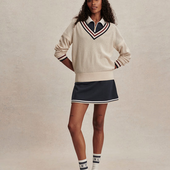 v neck cricket style knitted jumper in beige from varley model shot