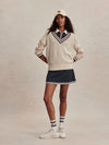 v neck cricket style knitted jumper in beige from varley model shot