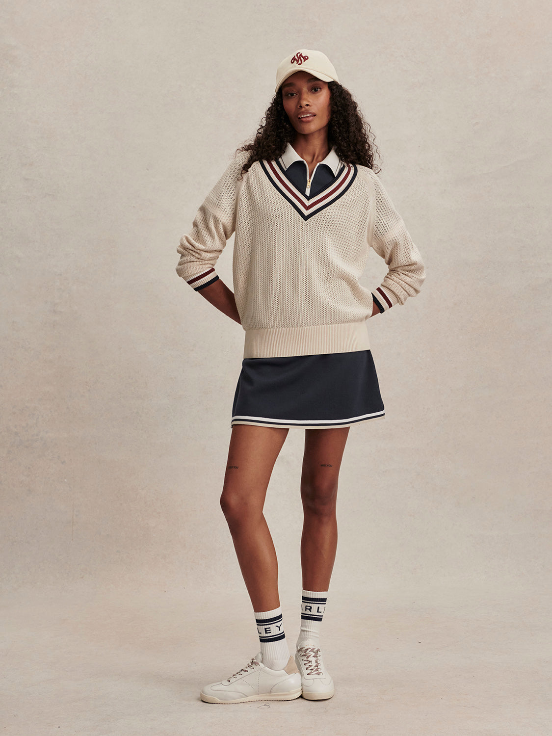 v neck cricket style knitted jumper in beige from varley model shot