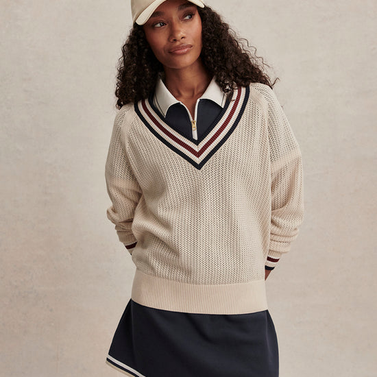 v neck cricket style knitted jumper in beige from varley model shot