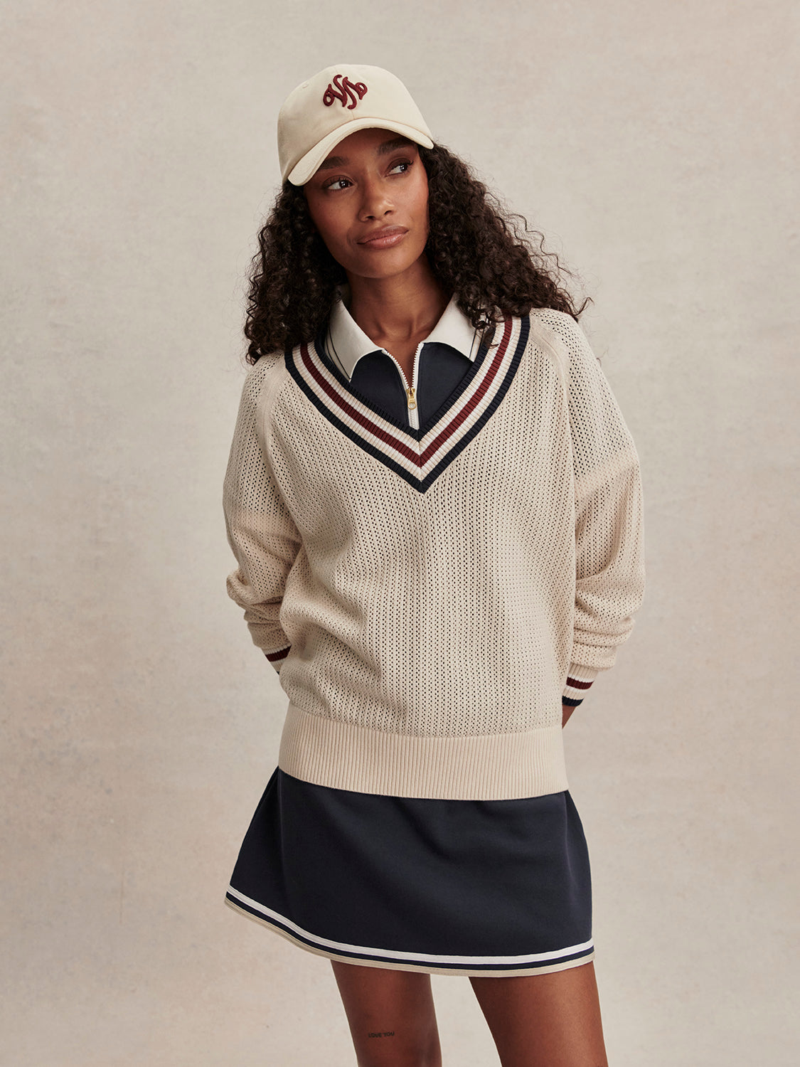 v neck cricket style knitted jumper in beige from varley model shot