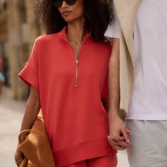 short sleeve coral half zip sweatshirt with high neck from varley model shot