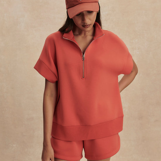 short sleeve coral half zip sweatshirt with high neck from varley