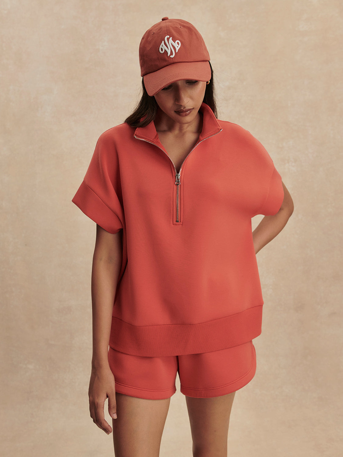 short sleeve coral half zip sweatshirt with high neck from varley