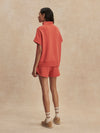 short sleeve coral half zip sweatshirt with high neck from varley rear view