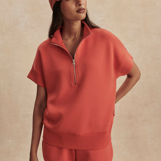 short sleeve coral half zip sweatshirt with high neck from varley model shot