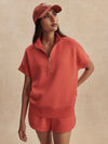 short sleeve coral half zip sweatshirt with high neck from varley model shot
