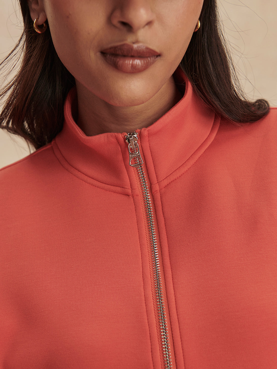 short sleeve coral half zip sweatshirt with high neck from varley close up
