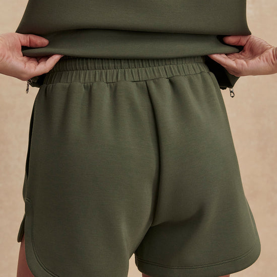 khaki green drawstring waistband short from varley rear view