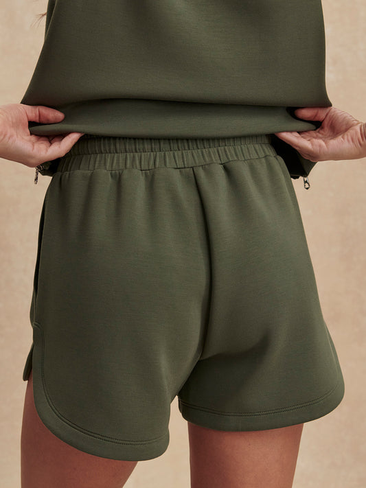 khaki green drawstring waistband short from varley rear view