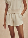 beige sweat pant shorts with drawstring waist from varley model shot
