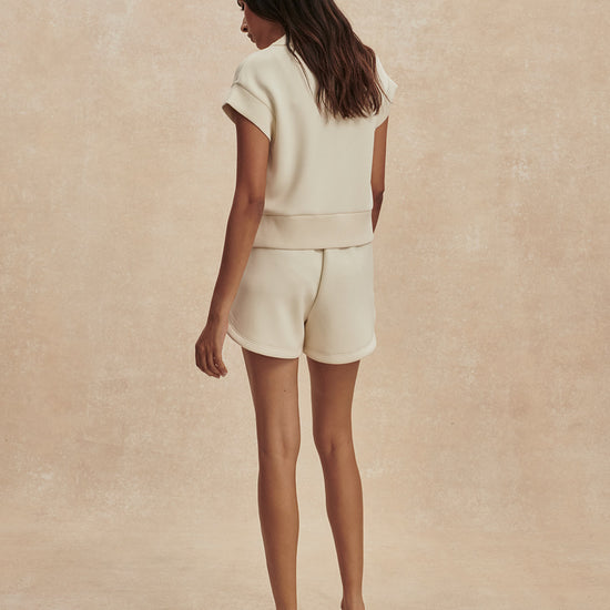 beige sweat pant shorts with drawstring waist from varley rear view