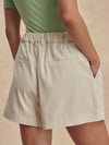 ivory chino style tailored shorts with double buttons and pleat detailing from varley rear view
